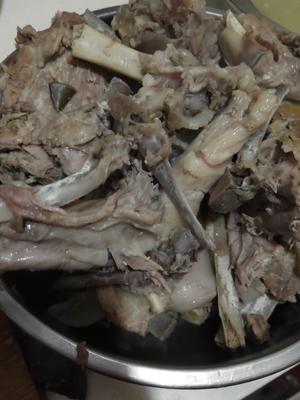 After cooking for over two hours, gently touch a piece of mutton against the large bone. If they easily separate, it's almost done.